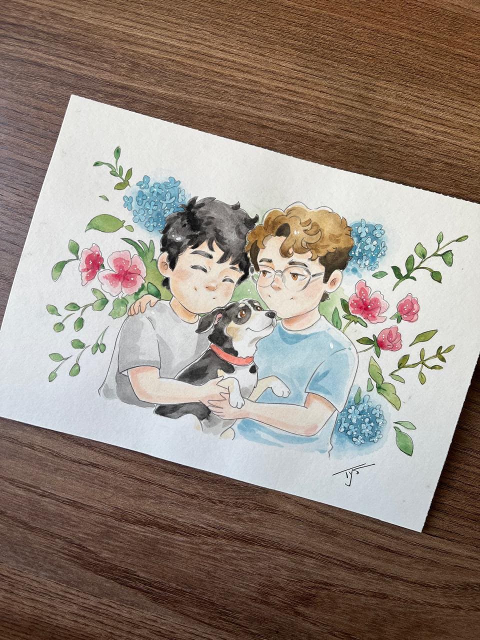 Fotografia de uma aquarela de um casal com cachorro e gato.